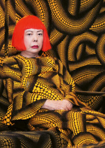 KUSAMA WITH YELLOW TREE / LIVING ROOM AT THE AICHI TRIENNALE, 2010 © YAYOI KUSAMA, Courtesy of Ota Fine Arts, Victoria Miro, David Zwirner